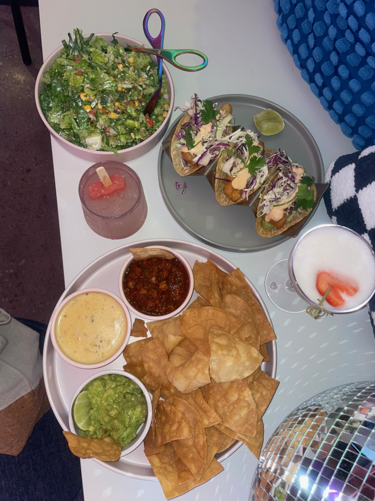 Pictured: Chips 'n Dip Trio, Baja Fish Tacos, Texas Chopper Salad, and the Southside Cooler (left), and the Love Potion (right)